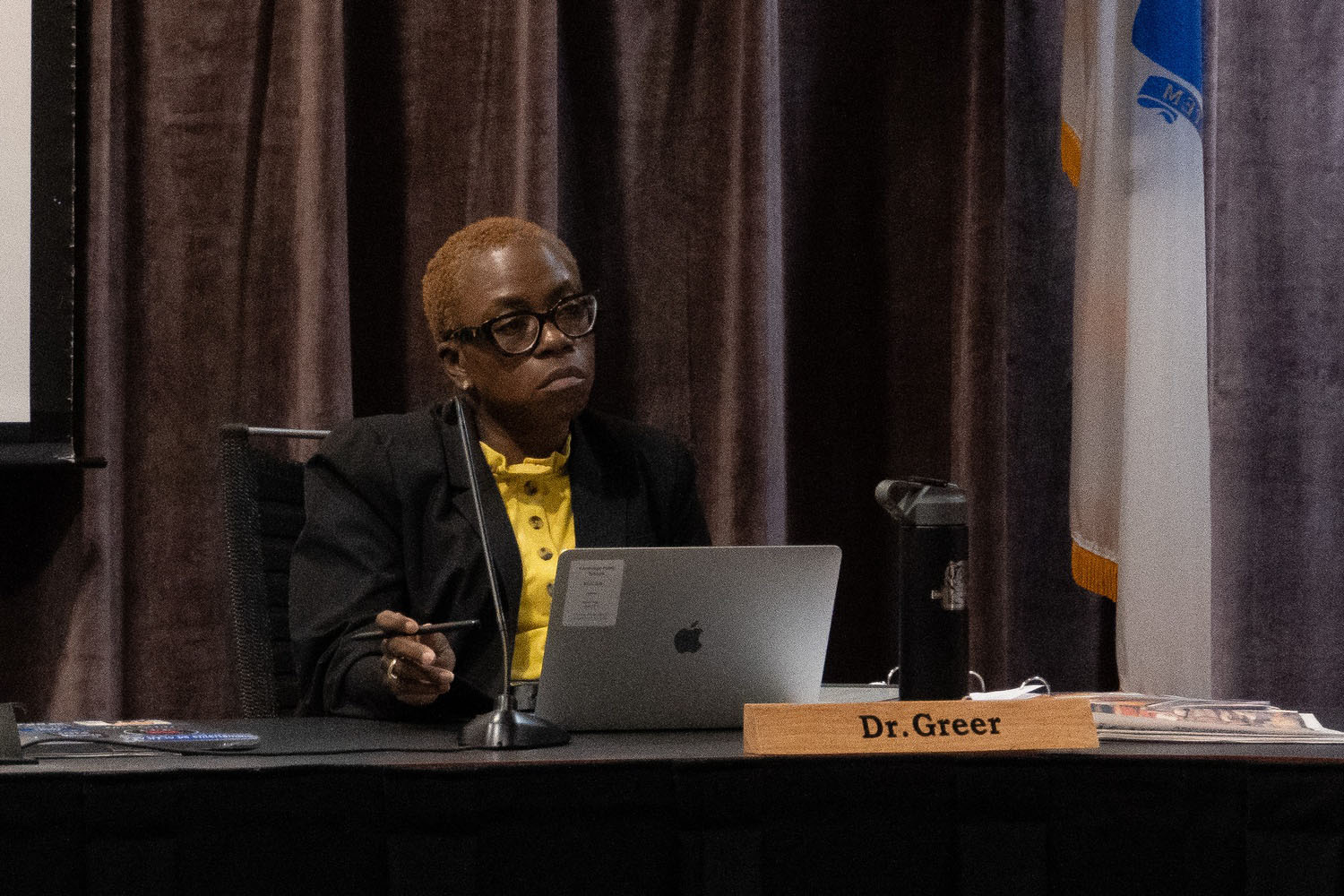 Superintendent Victoria L. Greer sits at a meeting of the Cambridge School Committee in the Cambridge Rindge and Latin school. Nearly 30 parents demanded change from Greer and district leadership during that meeting.