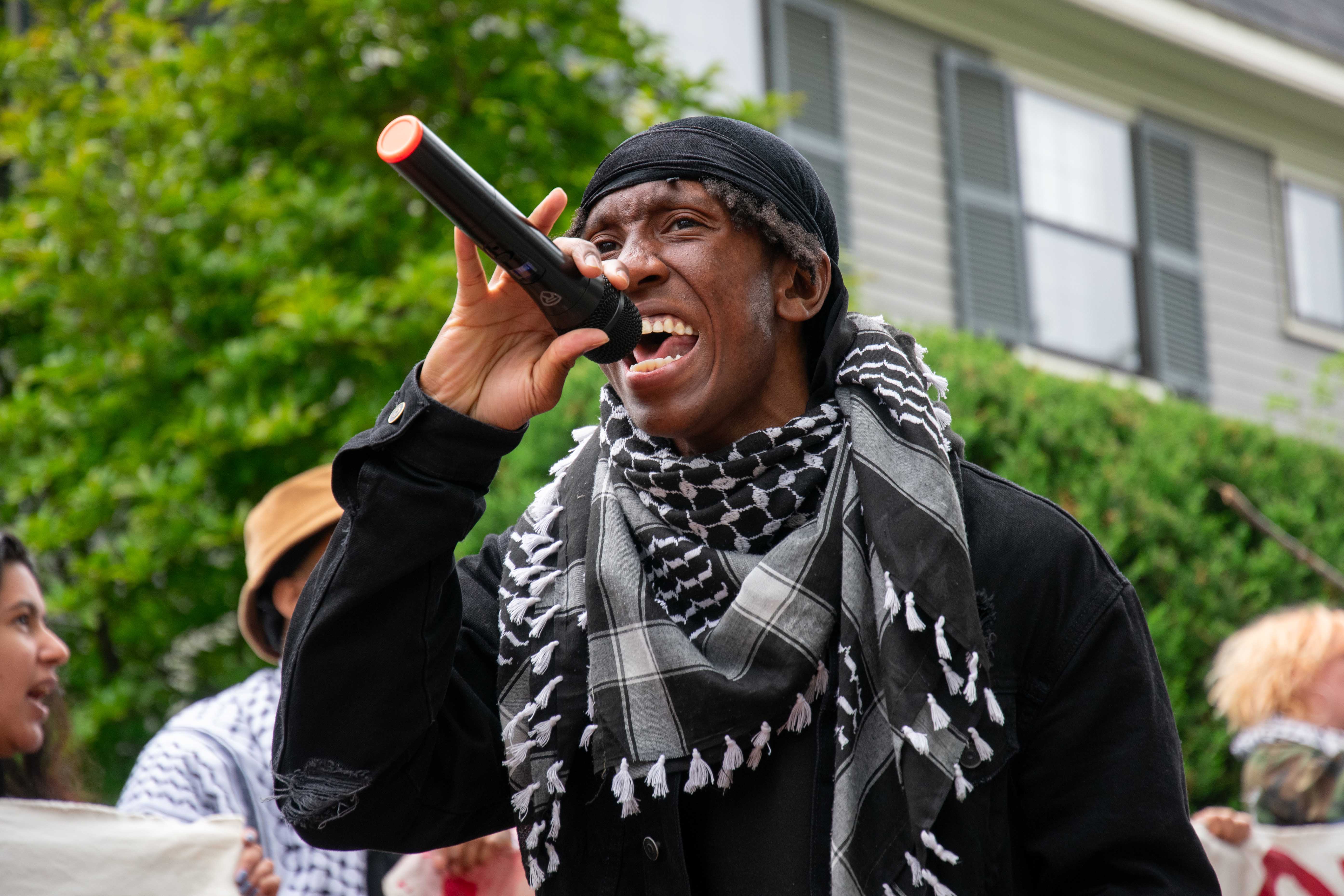 Acheampong speaks at a rally outside the house of interim Harvard President Alan M. Garber ’76. At the rally — which drew more than 200 Harvard students, affiliates, and local residents — HOOP warned University administrators to prepare for disruptions to Thursday’s Commencement ceremonies.