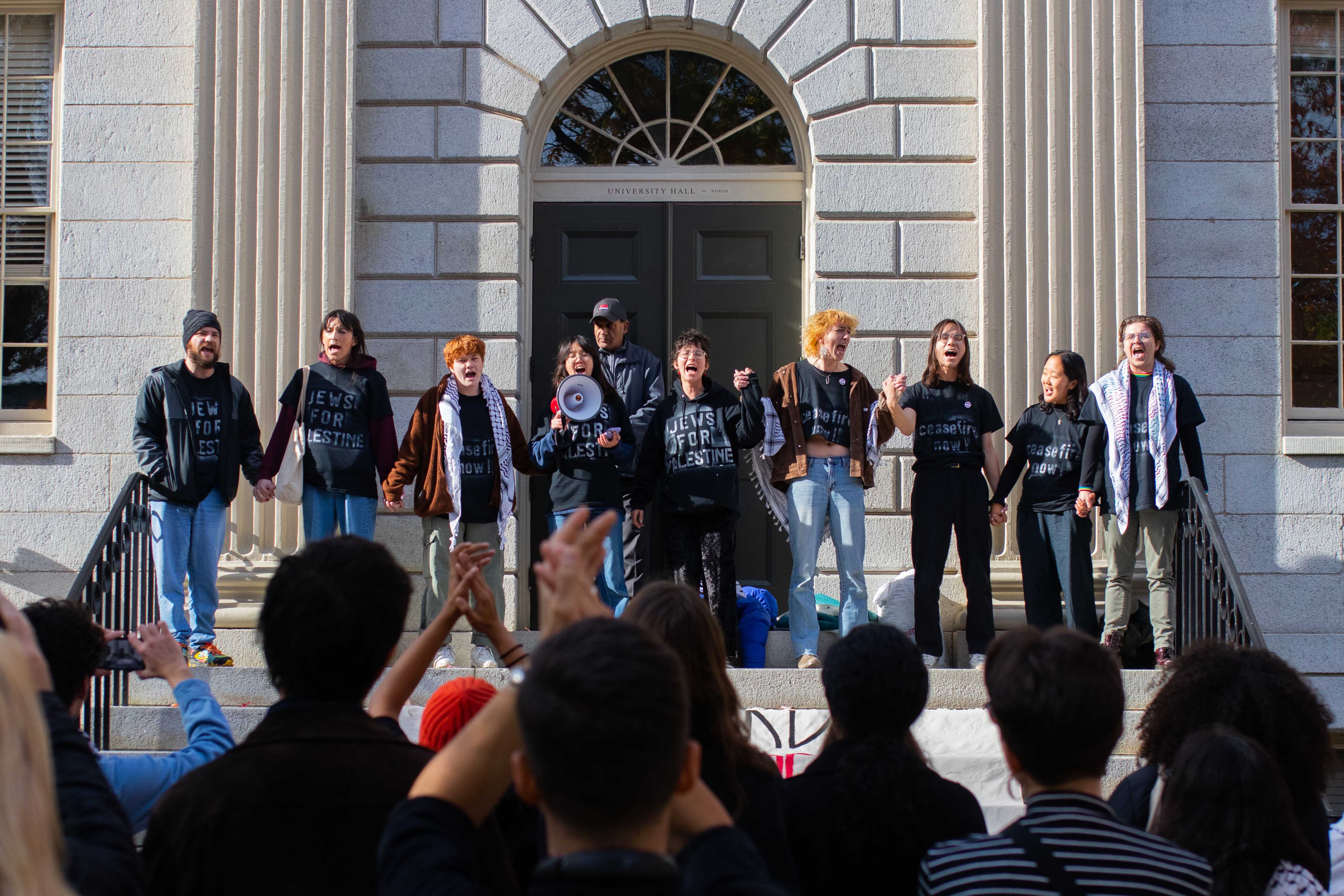 Nine student demonstrators gather on the steps of University Hall at the end of a 24-hours sit-in calling for a ceasefire in the Israel-Hamas war.