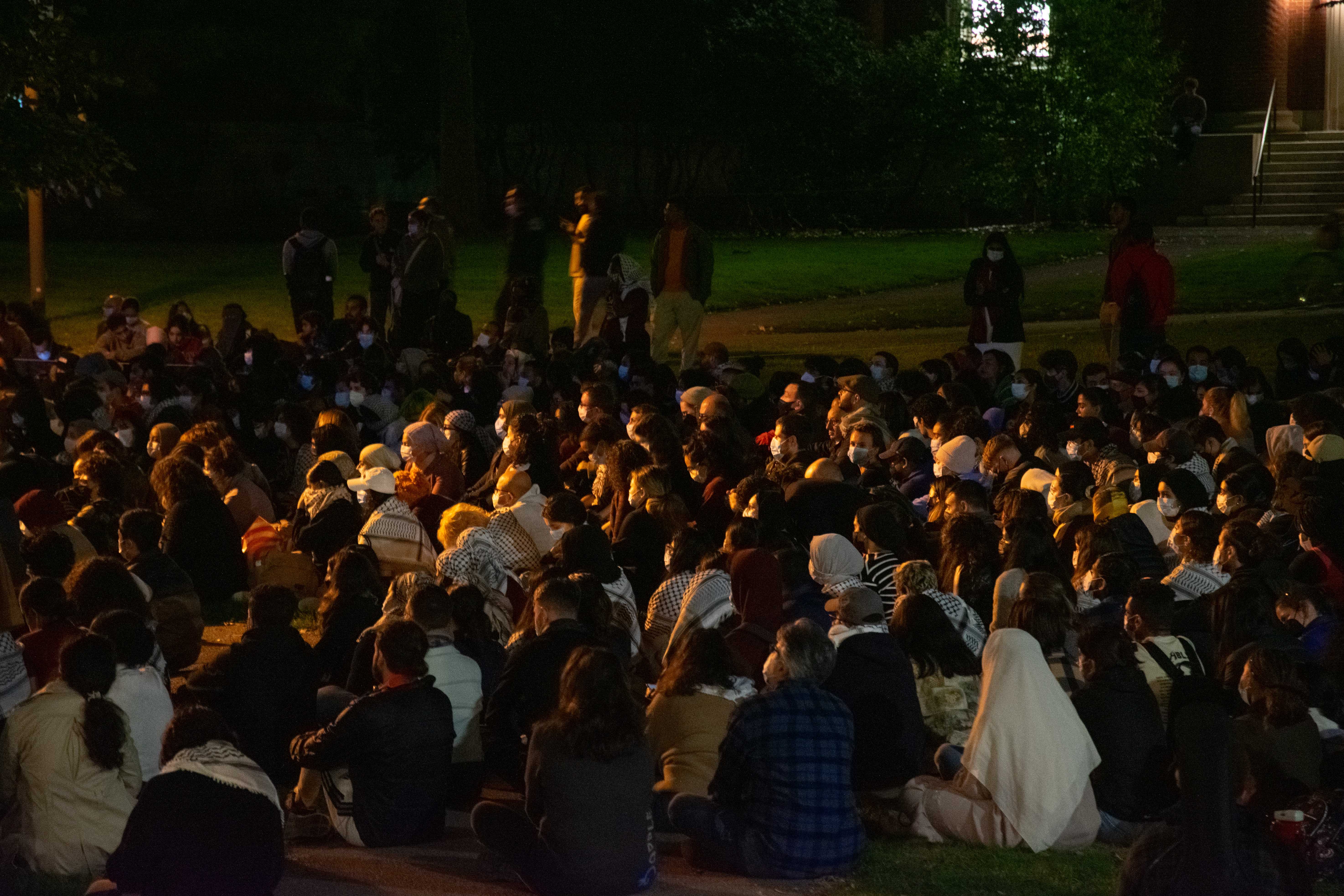 Hundreds of Harvard students and affiliates gather in the Sever Quadrangle for a silent vigil to mourn civilian deaths in Gaza and Israel and stand in solidarity with Palestine.
