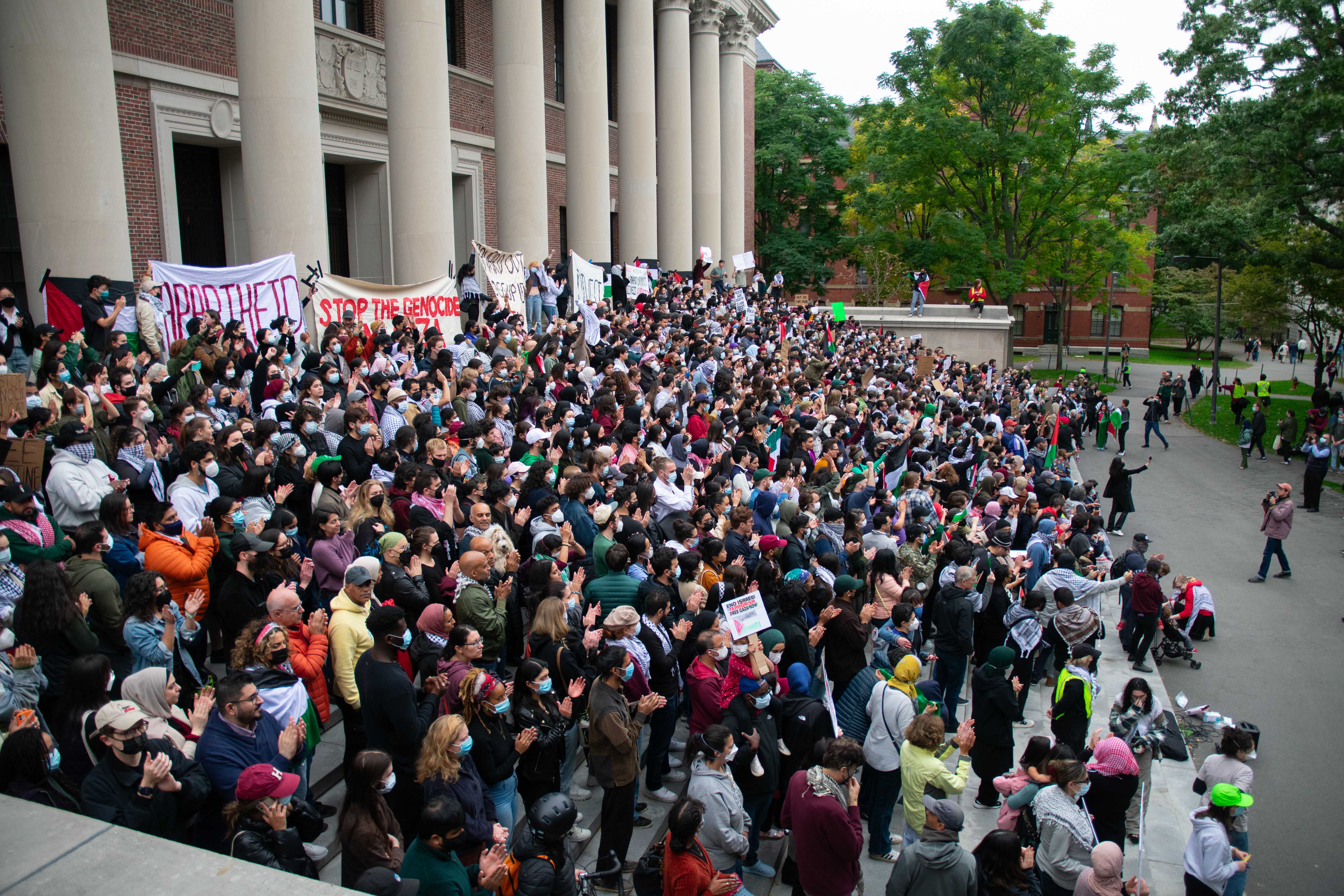 More than 1,000 demonstrators rally on the steps of Widener Library in Harvard Yard in support of Gaza. The protest came ahead of an expected ground invasion by Israel, and attendees condemned the University for a lack of support of Palestinian students and complicity in what they called Israeli “genocide.”