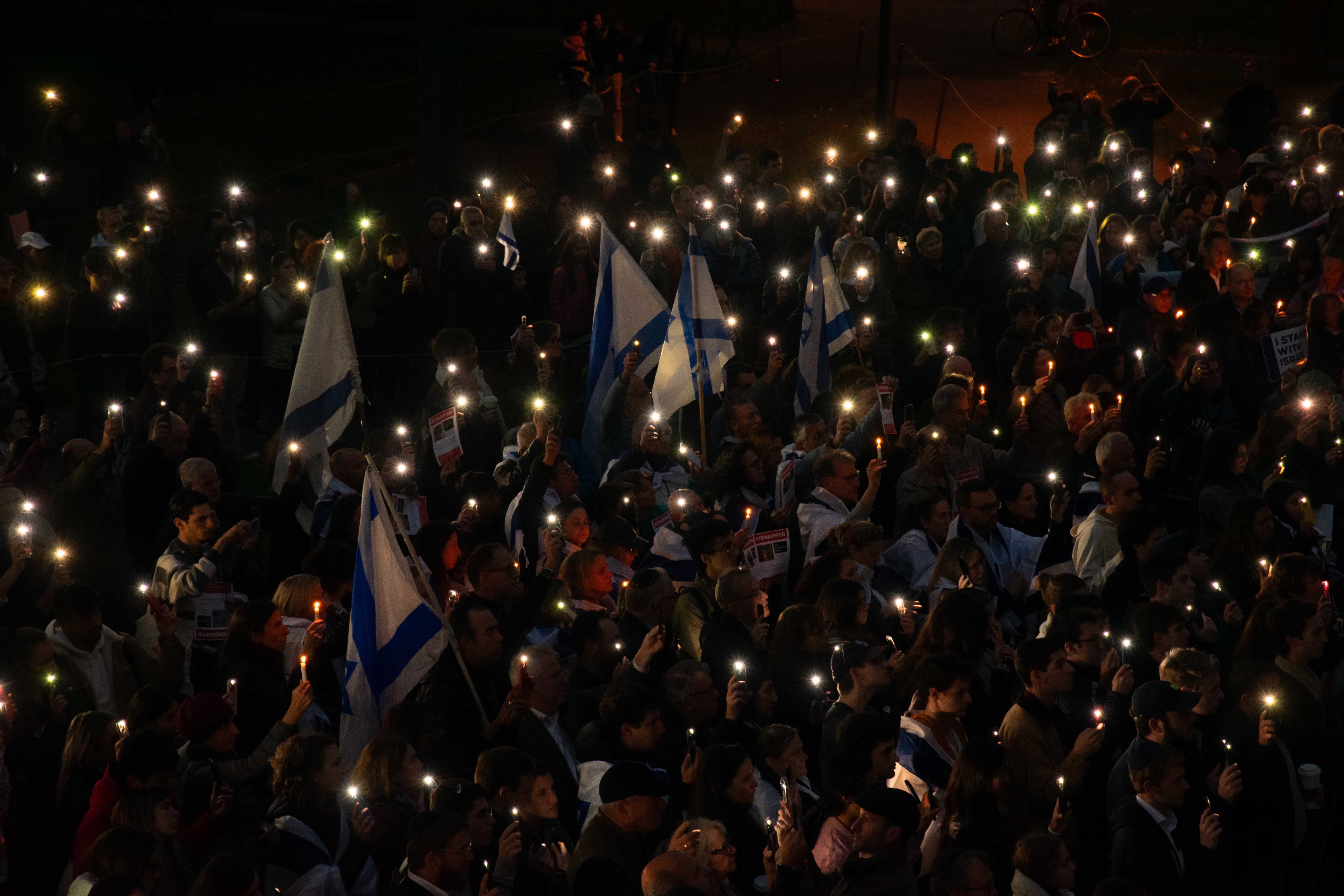 More than 1,000 people gather by the steps of Widener Library for a vigil to stand in solidarity with Israel and mourn the civilian deaths of the Oct. 7 attacks. The vigil was jointly organized by Harvard Hillel and Harvard Chabad, and included speeches, songs, and chants.