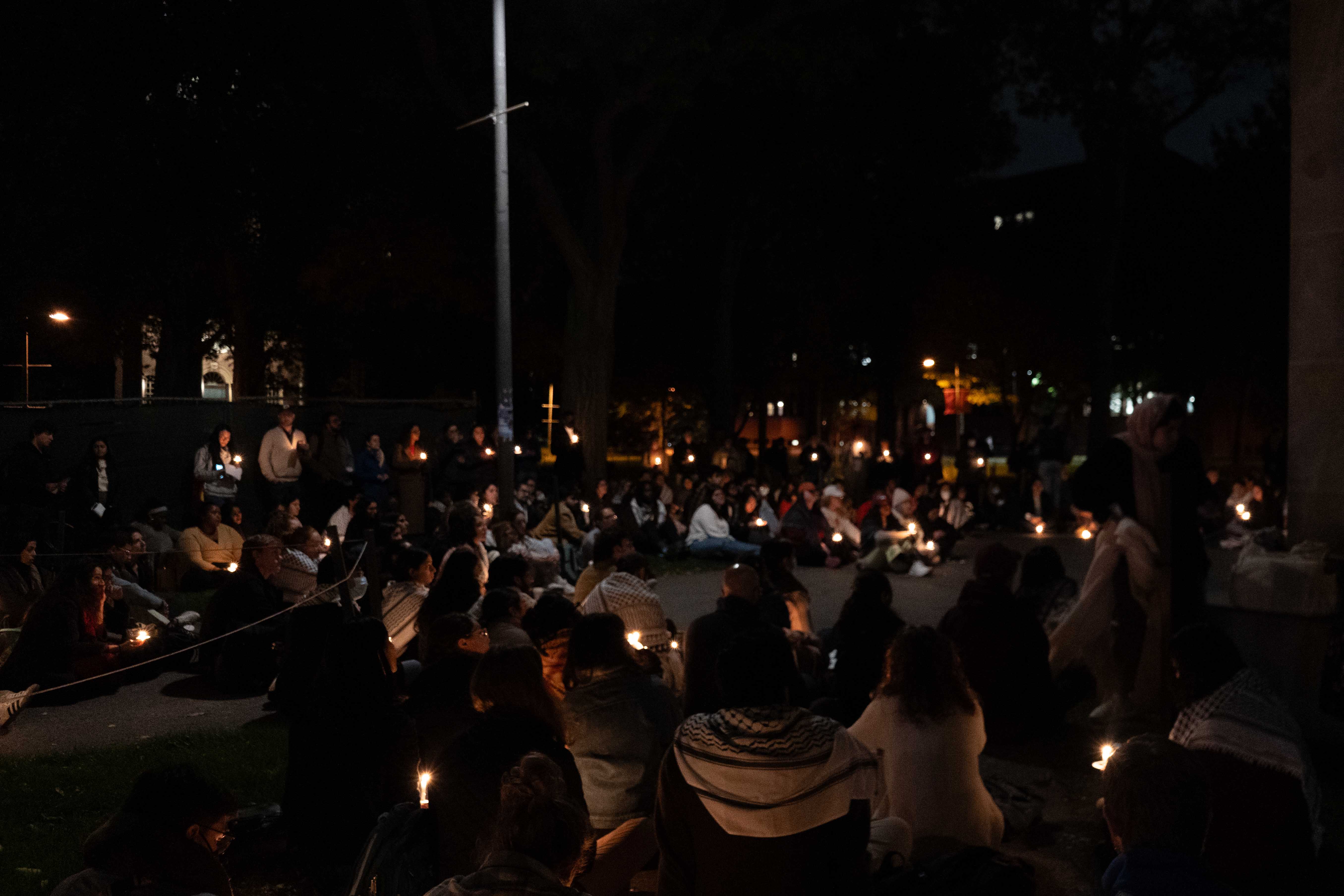 More than 150 Harvard affiliates mourn the deaths of Palestinian children in a vigil by the steps of Widener Library organized by the Harvard Undergraduate Palestine Solidarity Committee and Graduate Students 4 Palestine.