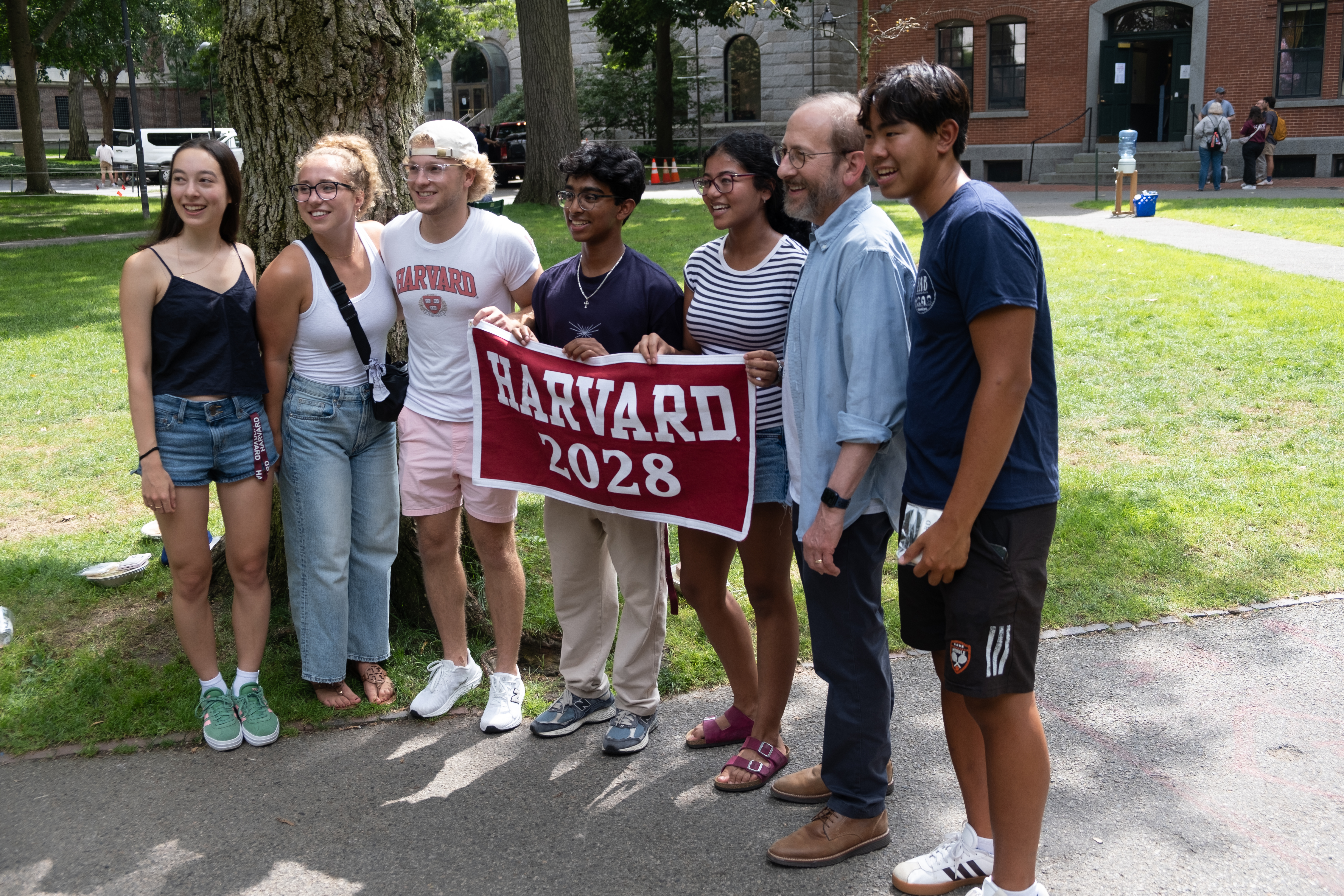 Harvard President Alan M. Garber greets members of the Class of 2028 as they settle into Harvard Yard on move-in day.