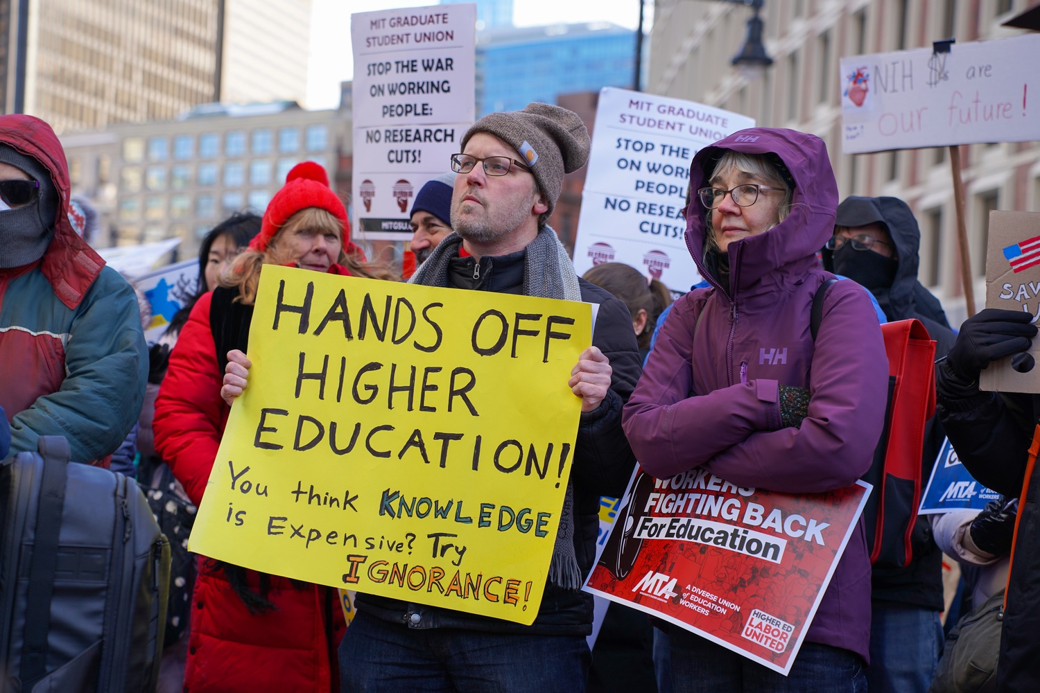 Researchers and educators rally outside the John F. Kennedy Federal Building in downtown Boston to protest President Donald Trump’s proposed cuts to federal research funding. The February demonstration drew more than 300 academic workers and students.