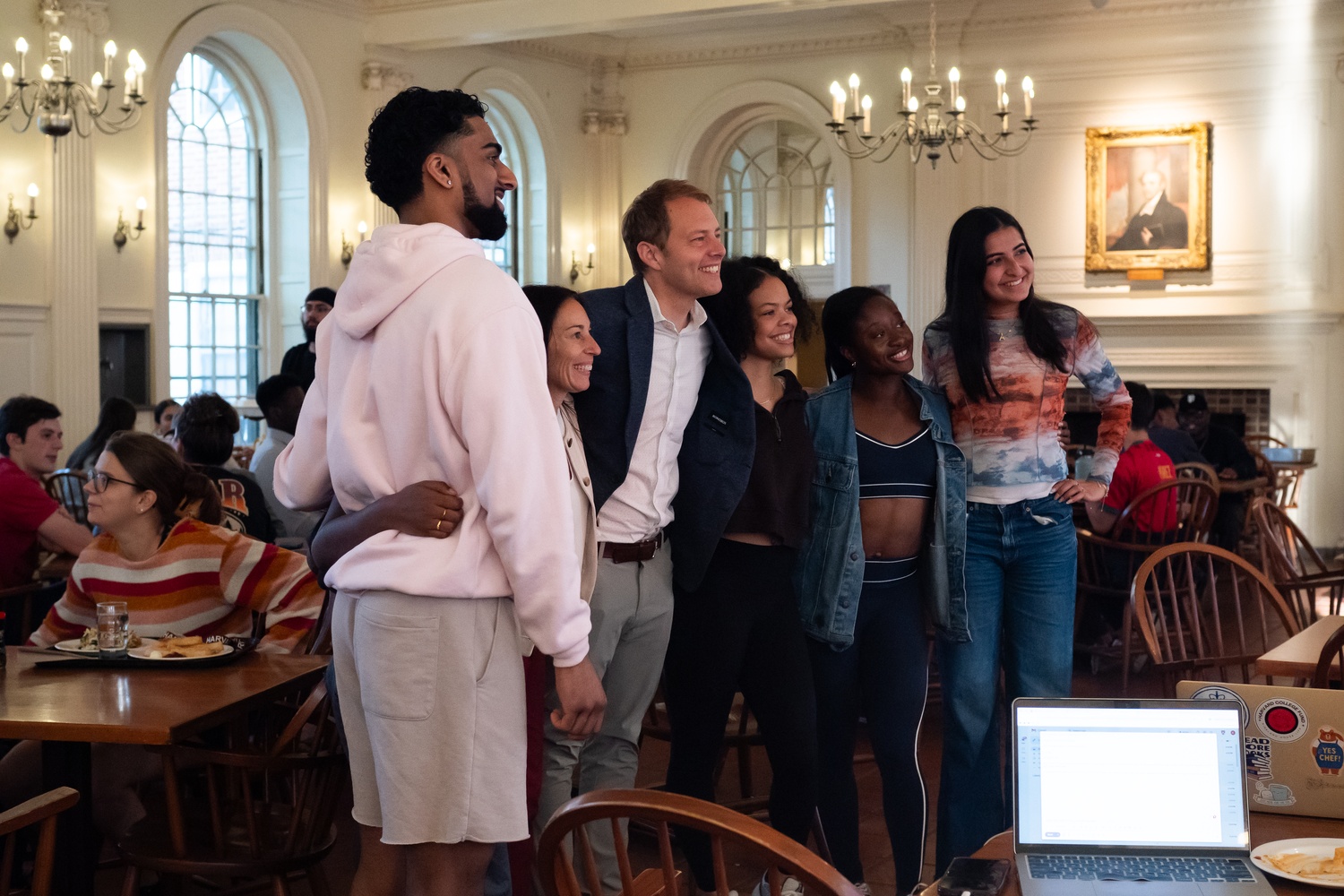 Kirkland House Faculty Dean David J. Deming takes a photo with students in the Kirkland dining hall after Hoekstra announced he would leave his current role to serve as the next dean of Harvard College. Deming — a Harvard Kennedy School professor — will assume the deanship on July 1.