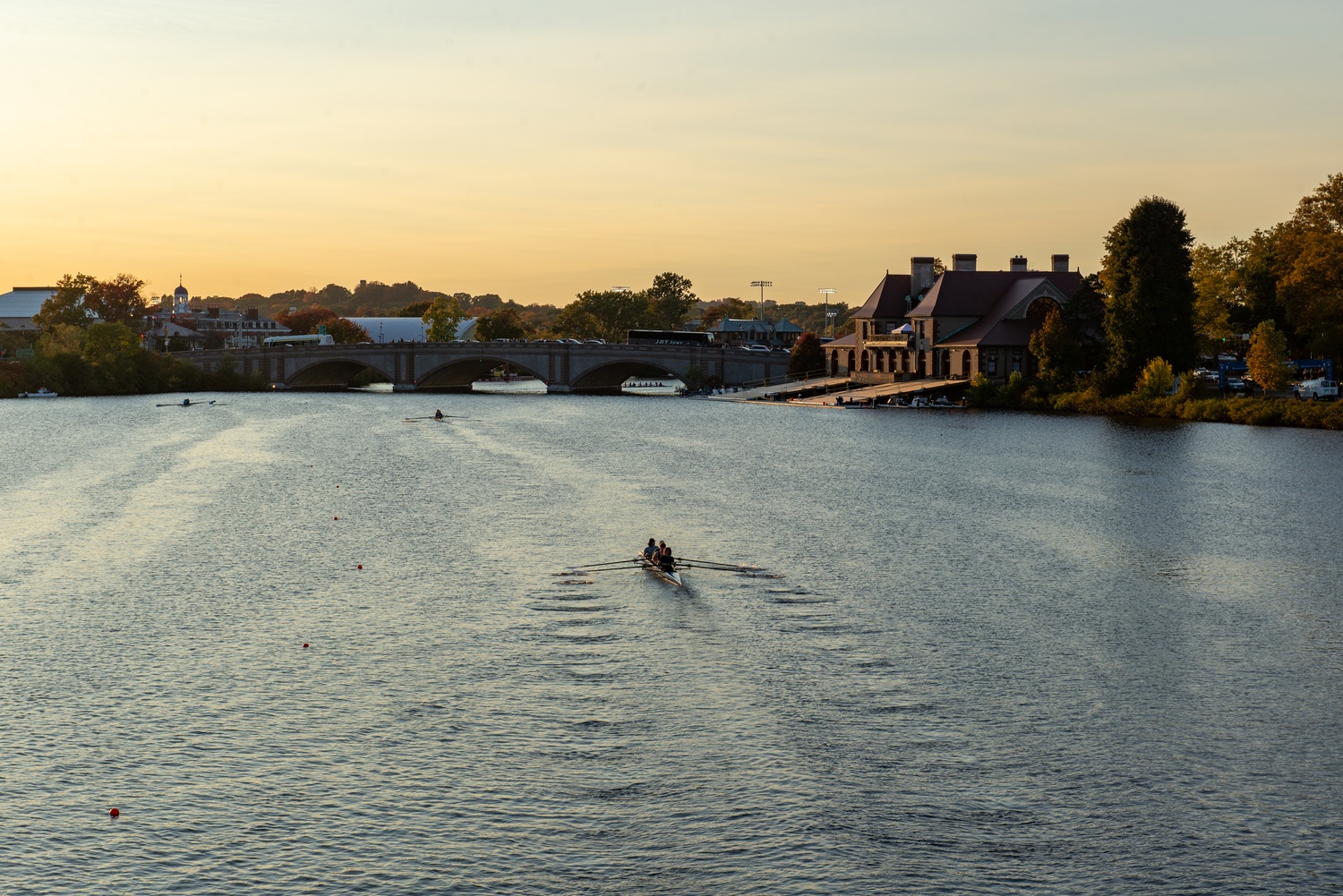 Rowers make their way down the Charles River past Weld Boathouse during the 59th Head of the Charles Regatta. The annual October event brings thousands of athletes and spectators to Cambridge for one of the world’s largest rowing competitions.