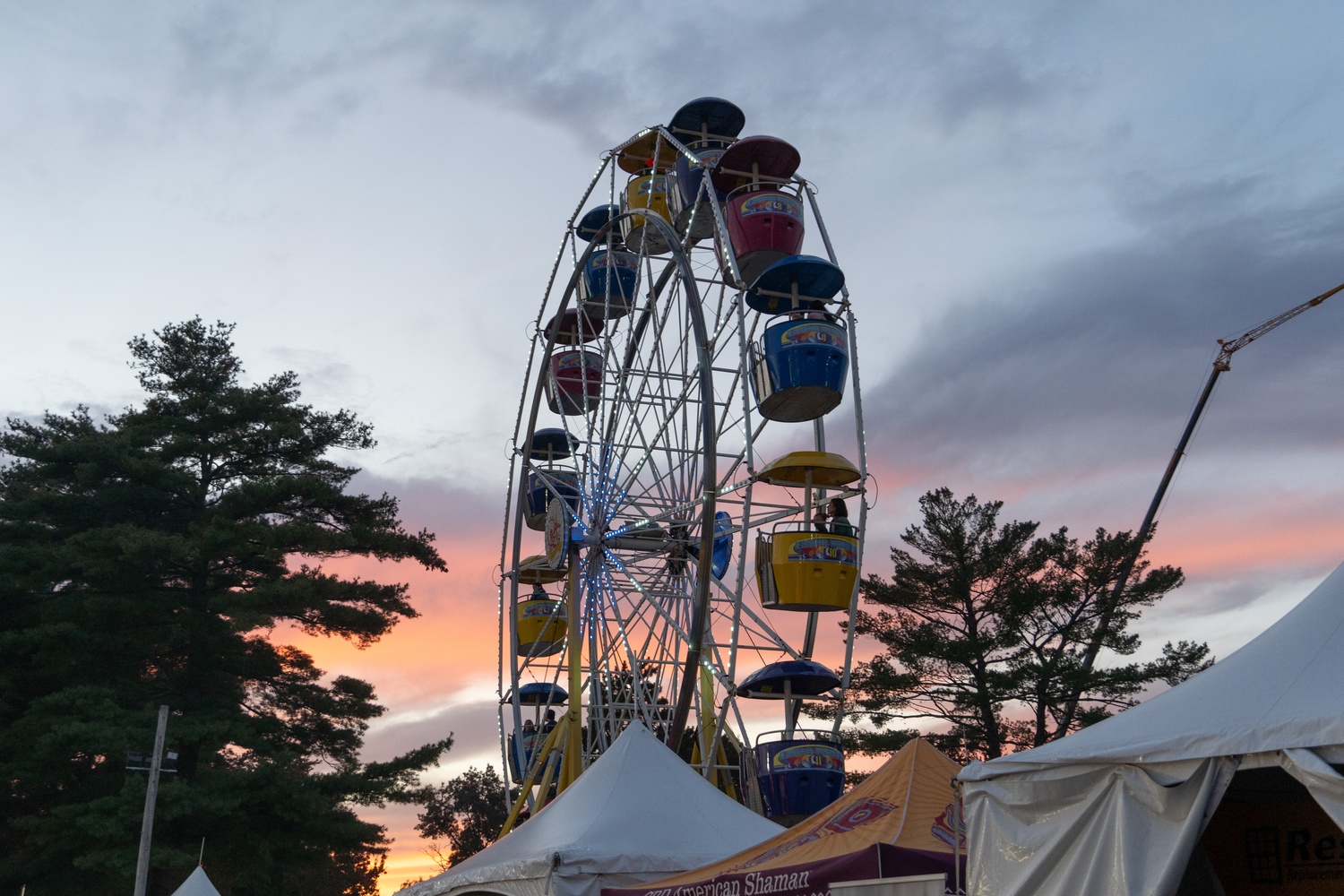 A Ferris wheel rises over the Topsfield Fairgrounds during the 206th edition of the Topsfield Fair. Located in Essex County, Massachusetts, the fair is the oldest continuously operating agricultural fair in the United States.