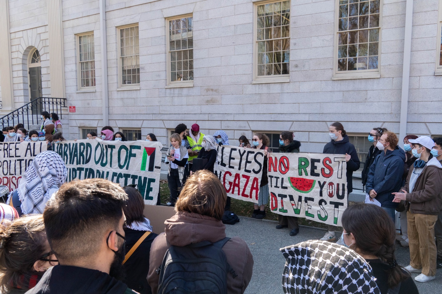 Dozens of Harvard affiliates gather outside University Hall during a rally organized by Harvard Out of Occupied Palestine to protest President Alan Garber’s pledge to cooperate with a Trump administration task force on antisemitism and the University’s dismissal of two Middle East studies professors.