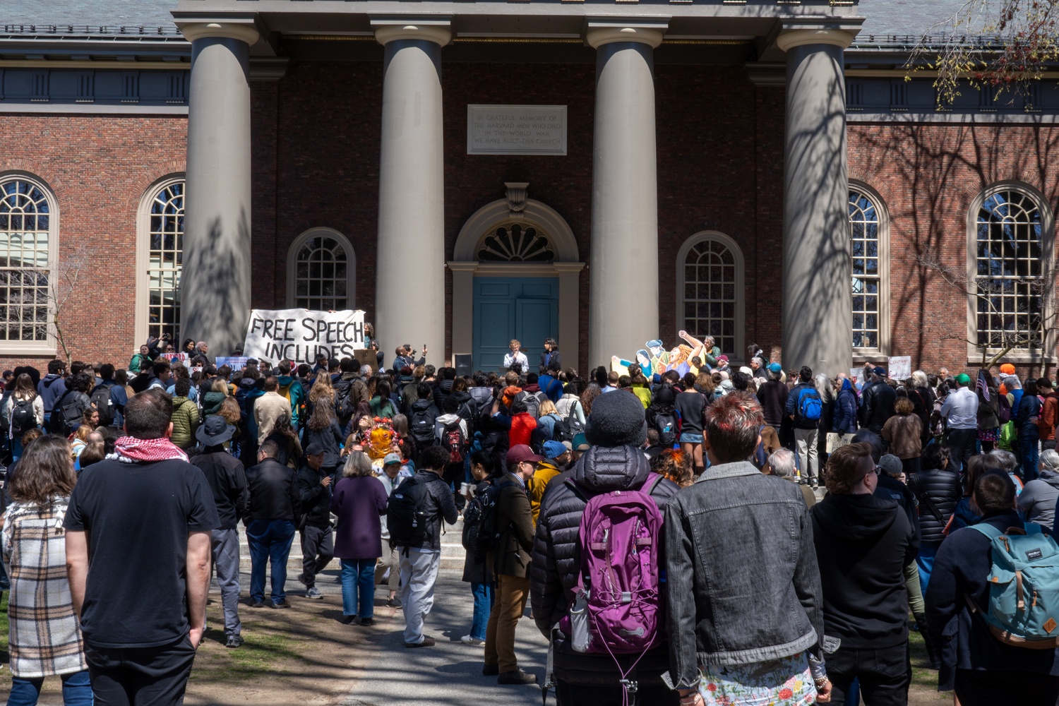 Students speak with international peers on the steps of Memorial Church during a rally supporting Harvard’s rejection of Trump administration demands. More than 500 affiliates gathered to oppose federal threats to deport international students and applauded the University’s decision not to share disciplinary data with immigration authorities.