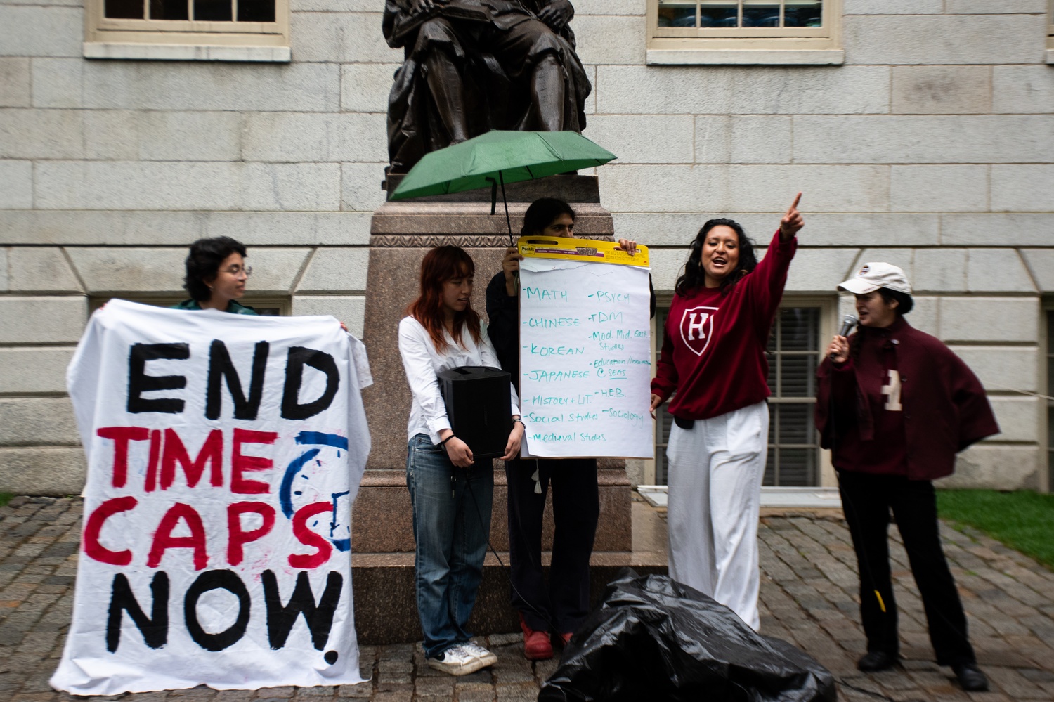 Harvard College students gather in the Yard to protest University time caps on non-tenure-track faculty. The demonstration coincided with a Faculty of Arts and Sciences meeting where Armenian preceptor Lisa Gulesserian – who had just received a teaching award – interrupted the proceedings to denounce the policy that will end her appointment at the end of the semester.