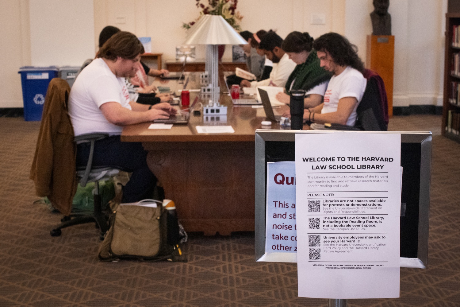 As Harvard Law School students staged a study-in protest in Langdell Hall’s library, flyers warned that participants could be ID’d. More than 50 students silently studied for 40 minutes before exiting the building without any disciplinary action.