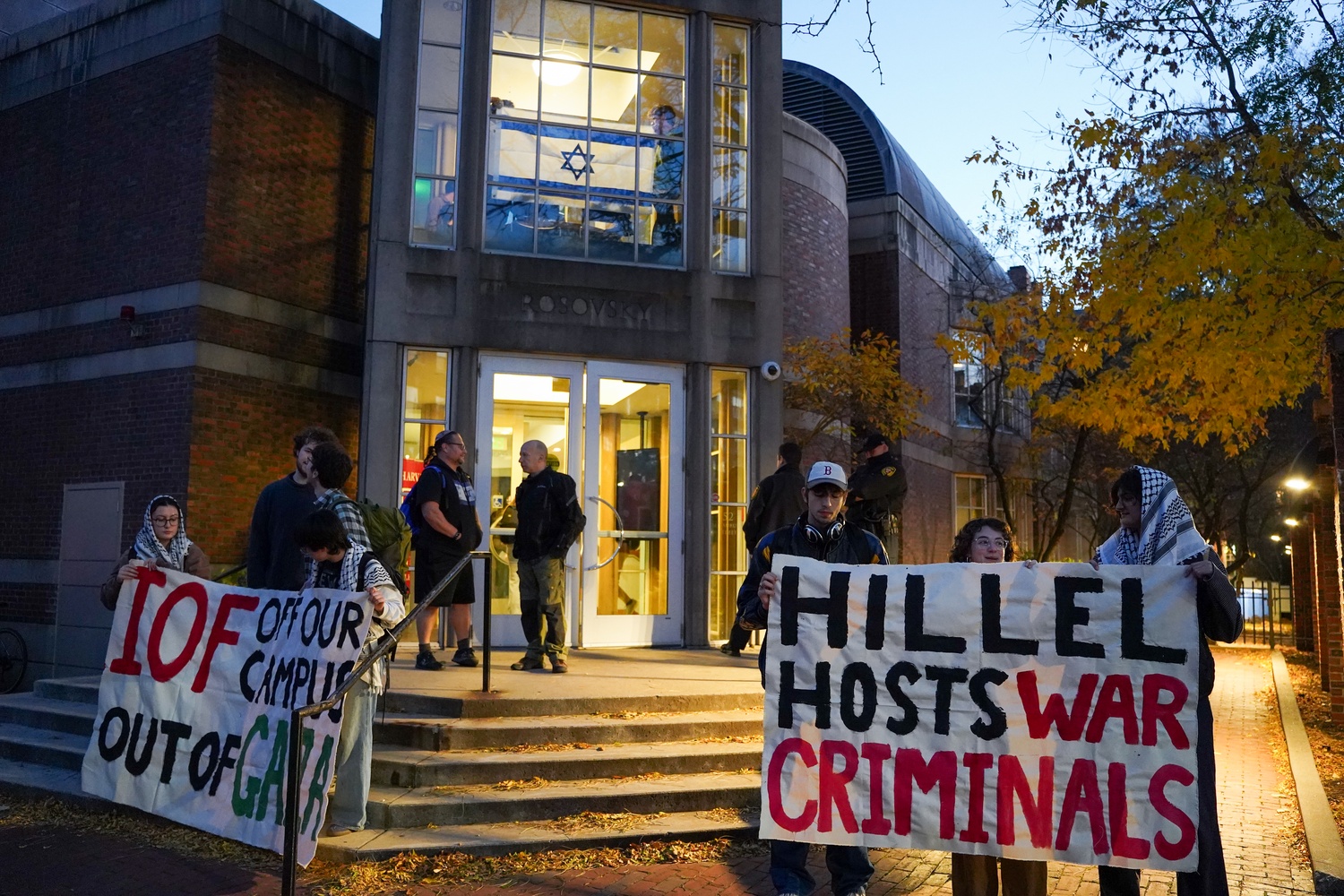 Students holding banners rally outside Harvard Hillel to protest a talk by former Israel Defense Forces spokesperson Ronen Manelis. Organized by Harvard Jews for Palestine, the demonstration criticized Hillel’s invitation to Manelis and marked the first protest outside the center in several years.